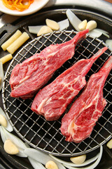 mutton being cooked over charcoal 숯불위에 익어가고 있는 양고기