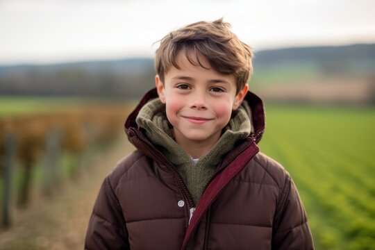 Close-up portrait photography of a glad kid male wearing a warm parka against a picturesque vineyard background. With generative AI technology