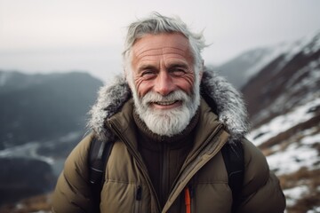 Fototapeta na wymiar Close-up portrait photography of a grinning old man wearing a cozy winter coat against a scenic mountain trail background. With generative AI technology
