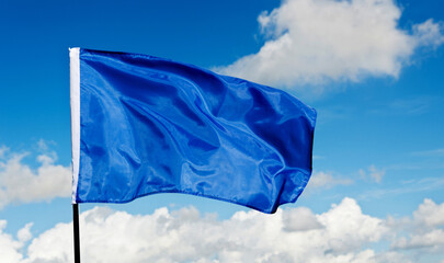 Blue flag waving on sky