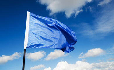Blue flag waving on sky