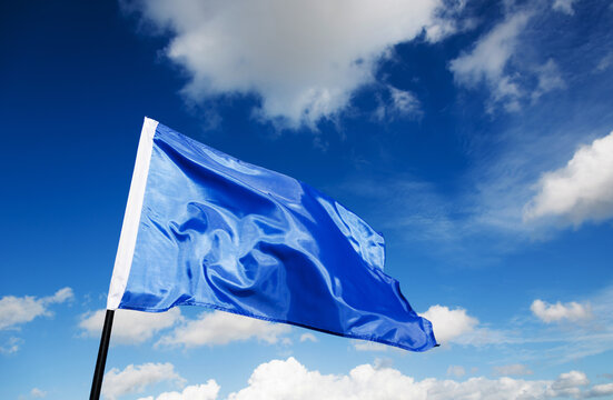 Blue flag waving on sky