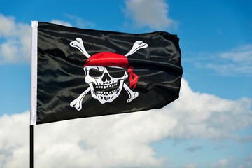 Pirate flag waving on sky