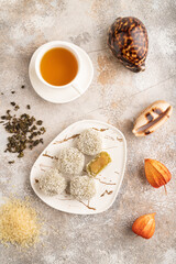 Japanese rice sweet buns mochi filled with pandan jam on brown concrete, top view.