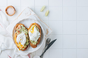 Avocado toast with poached egg. Healhty breakfast concept.