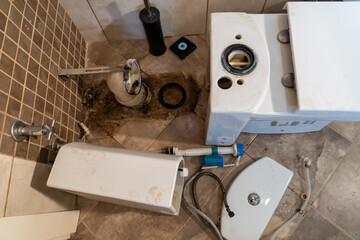 Repairing of the current old toilet bowl at work in bathroom, plumbing repair service, cleaning,...