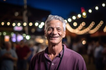 Environmental portrait photography of a tender mature man wearing a casual short-sleeve shirt against a lively concert venue background. With generative AI technology