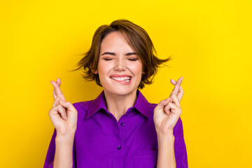 Photo portrait of pretty young girl cross fingers close eyes dressed stylish purple smart casual...