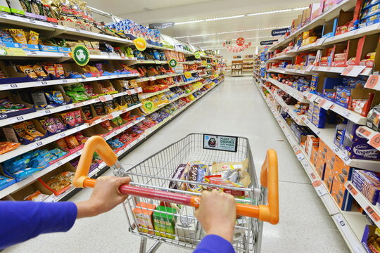 General view of a shopping trolley and aisle at a Sainsbury's supermarket on July 3, 2014 in London, UK. Sainsbury's is the UK's second largest supermarket with a revenue of £23 bln in 2013.