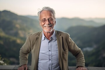 Medium shot portrait photography of a satisfied old man wearing an elegant long-sleeve shirt against a scenic mountain overlook background. With generative AI technology