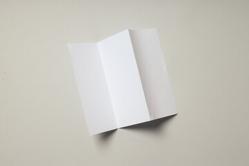 Blank white sheet on light gray background