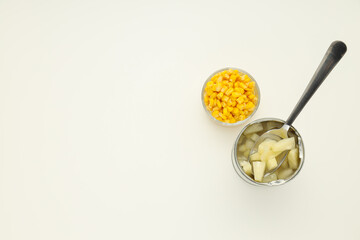 Ingredients for cooking salad, corn seeds and canned pineapple