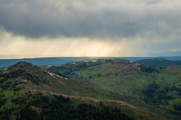 Fototapeta premium Row of Rain Clouds Moves Across Yellowstone Wilderness