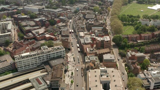 Dolly back aerial shot over Richmond Highstreet West London