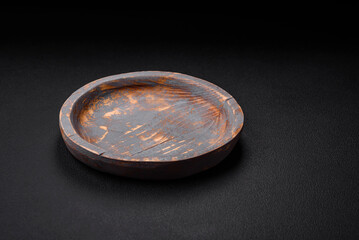 Empty wooden plate, knife, fork and cutting board