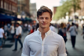 Obraz premium Medium shot portrait photography of a glad boy in his 30s wearing a classy button-up shirt against a bustling city square background. With generative AI technology