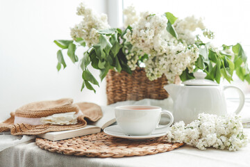 Cup of hot tea and spring home interior. good morning concept