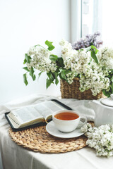 Open bible in spring interior, good morning concept