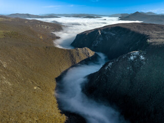 Mystical river of clouds in canyon, cold foggy winter autumn day - Mountains on the border of Bosnia and Herzegovina and Montenegro with canyon, Aerial Shot (wide) - Sutjeska National Park - obrazy, fototapety, plakaty