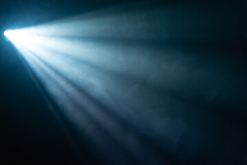 blue spotlight light beam on black background