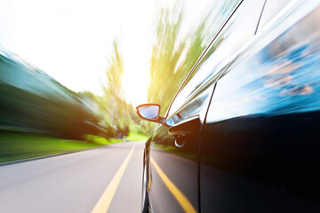 Obraz premium Car in motion blur driving in the forest