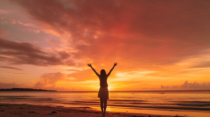 Fototapeta premium Happy woman silhouette in the sunset