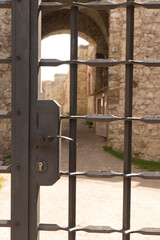 Closing in the gate to the Tanczyn Castle (castle ruins, fragments of walls) in the village of Rudno, near Krakow in Poland.