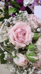 Roses in a bouquet of bridal flowers