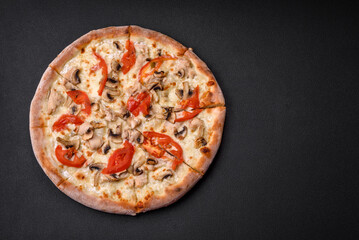 Delicious pizza with chicken, tomatoes and cheese with salt and sauce
