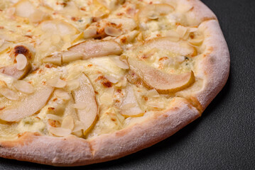 Delicious sweet pizza with pear, dorblu cheese and nuts