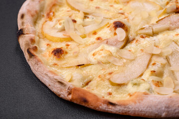 Delicious sweet pizza with pear, dorblu cheese and nuts