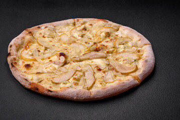 Delicious sweet pizza with pear, dorblu cheese and nuts