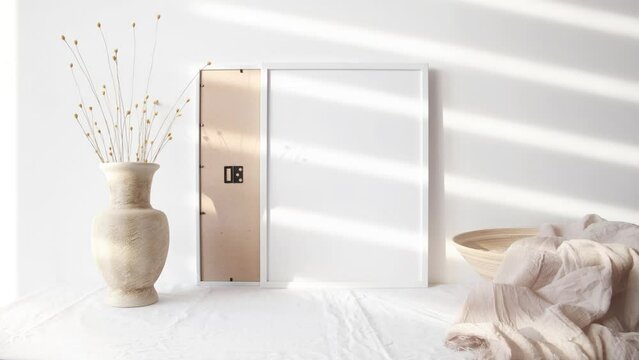 Video white photo frame mockup with beige vase 