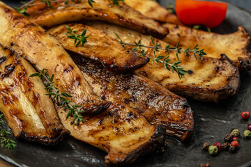 king oyster mushrooms, Pleurotus eryngii grilled with spices and herbs. Healthy vegan food concept,...