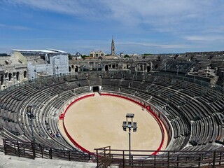Nîmes, May 2023 : Visit the beautiful city of Nîmes en Provence - Historical city with its arena and ancient theater - View on the arena - obrazy, fototapety, plakaty