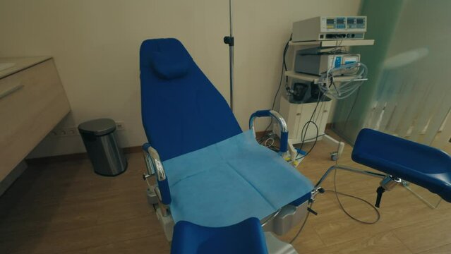 Interior of Gynecology Room in Medical Clinic. Gynecological Bed in Obstetrics and Gynecology Department of Hospital. Pregnancy Planning Concept.