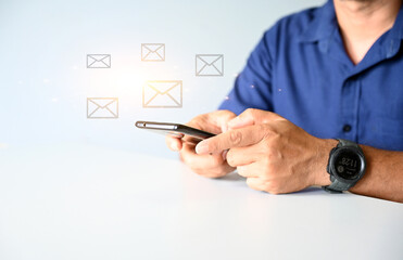 Businessman using smartphone to check electronic mail