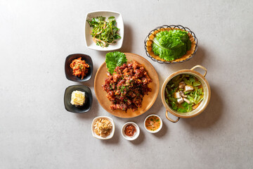 Jokbal, pork feet, steamed, salted oysters, spicy, noodles, garlic Korean food dish 