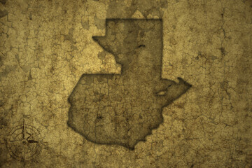 map of guatemala on a old vintage crack paper background .