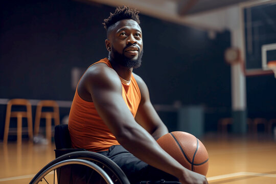African american man with basketball ball sitting in wheelchair in gym, generative ai