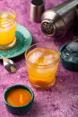 Summer cocktail with mango juice and ice