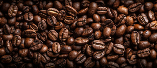 Fototapeta premium Coffee beans. Panoramic horizontal background of roasted coffee beans. Generative AI illustration.