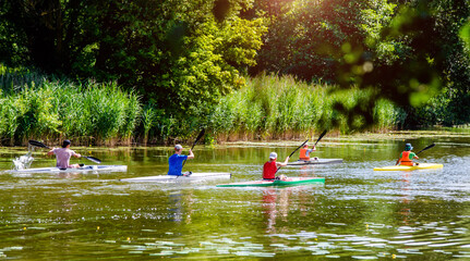 men floating in a canoe on the river
