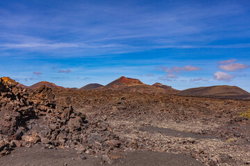 Lava of an extinct volcano in a valley on the Canary Island. Volcanic coast. Tourism.