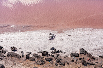 Coastal water area with dark sand and hardened volcanic lava. Canary Islands.