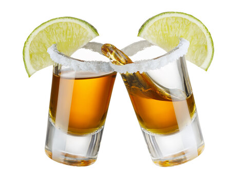 glasses shot of tequila with salt and lime making toast with splash isolated on white
