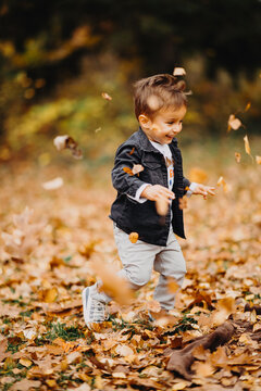 Child in the forest smiling and playing