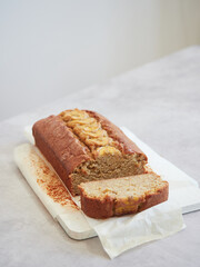 Sliced loaf of homemade banana bread. Ideas and recipes for healthy diet breakfast.
