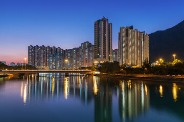 Obraz na płótnie Canvas High rise residential building and mountain in Hong Kong city at dusk