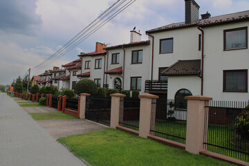 Fototapeta na wymiar A street with the same perfect houses